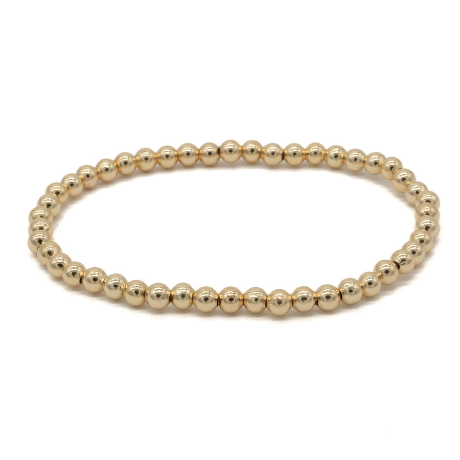 Pulsera de bolitas doradas