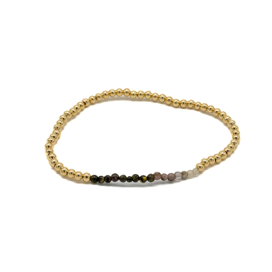 Pulsera dorada de bolitas con piedras