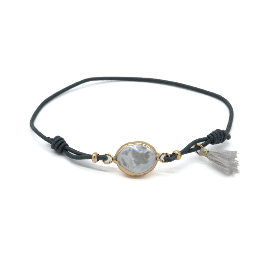 Pulsera de perla con pompón